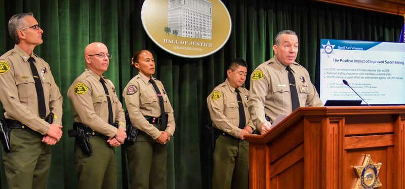 Sheriff Villanueva speaking to media from podium.