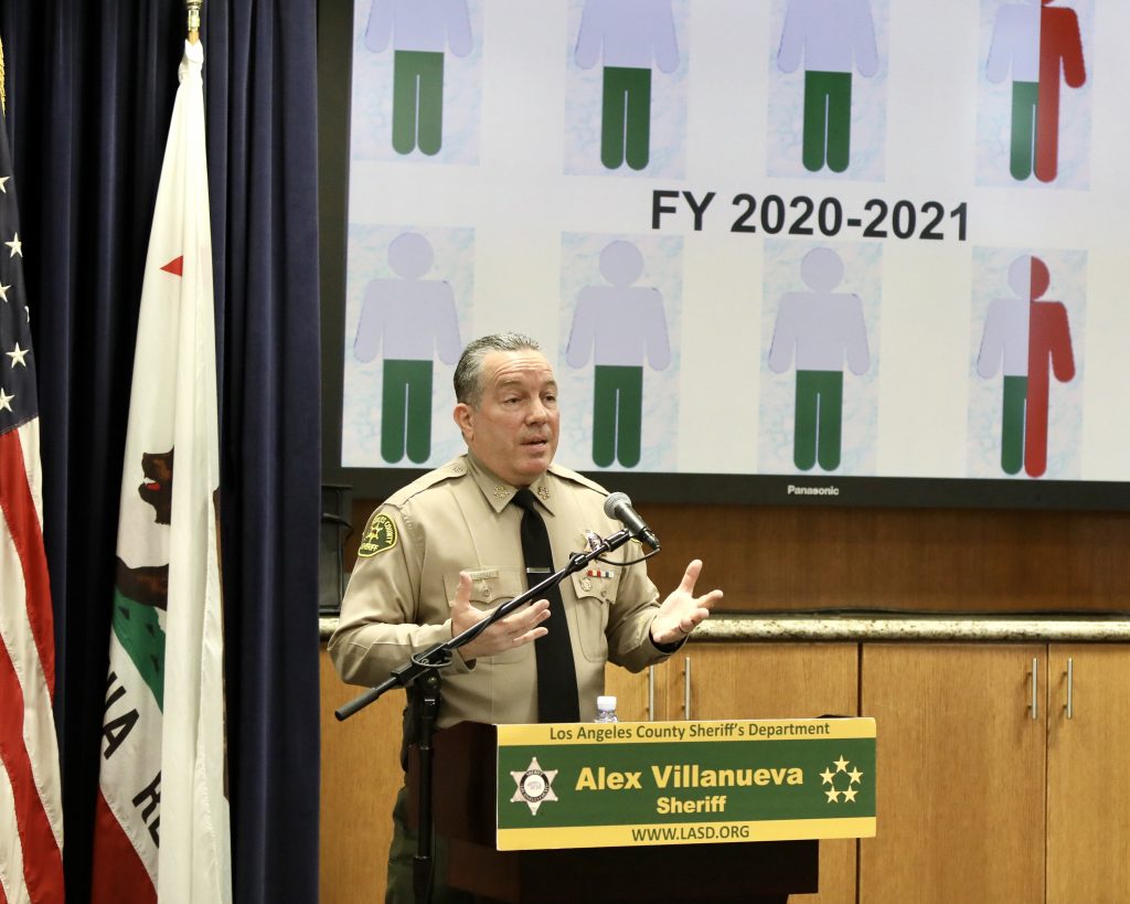 Sheriff presenting a slide infront of large screen