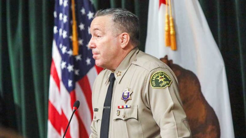 Sheriff Alex Villanueva infront of media giving a conference
